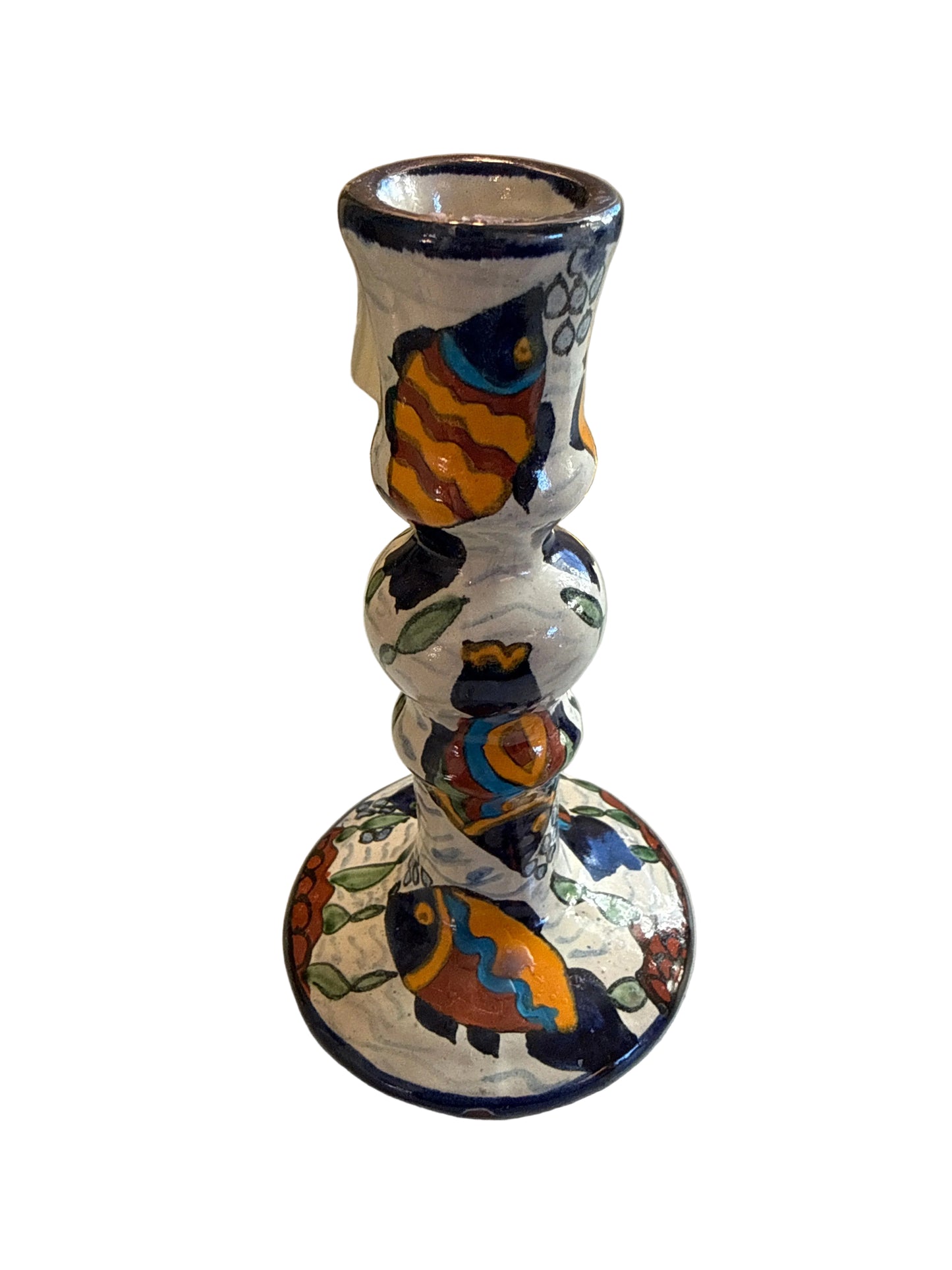 Decorative wall-mounted lamp with colorful design on a white wall.