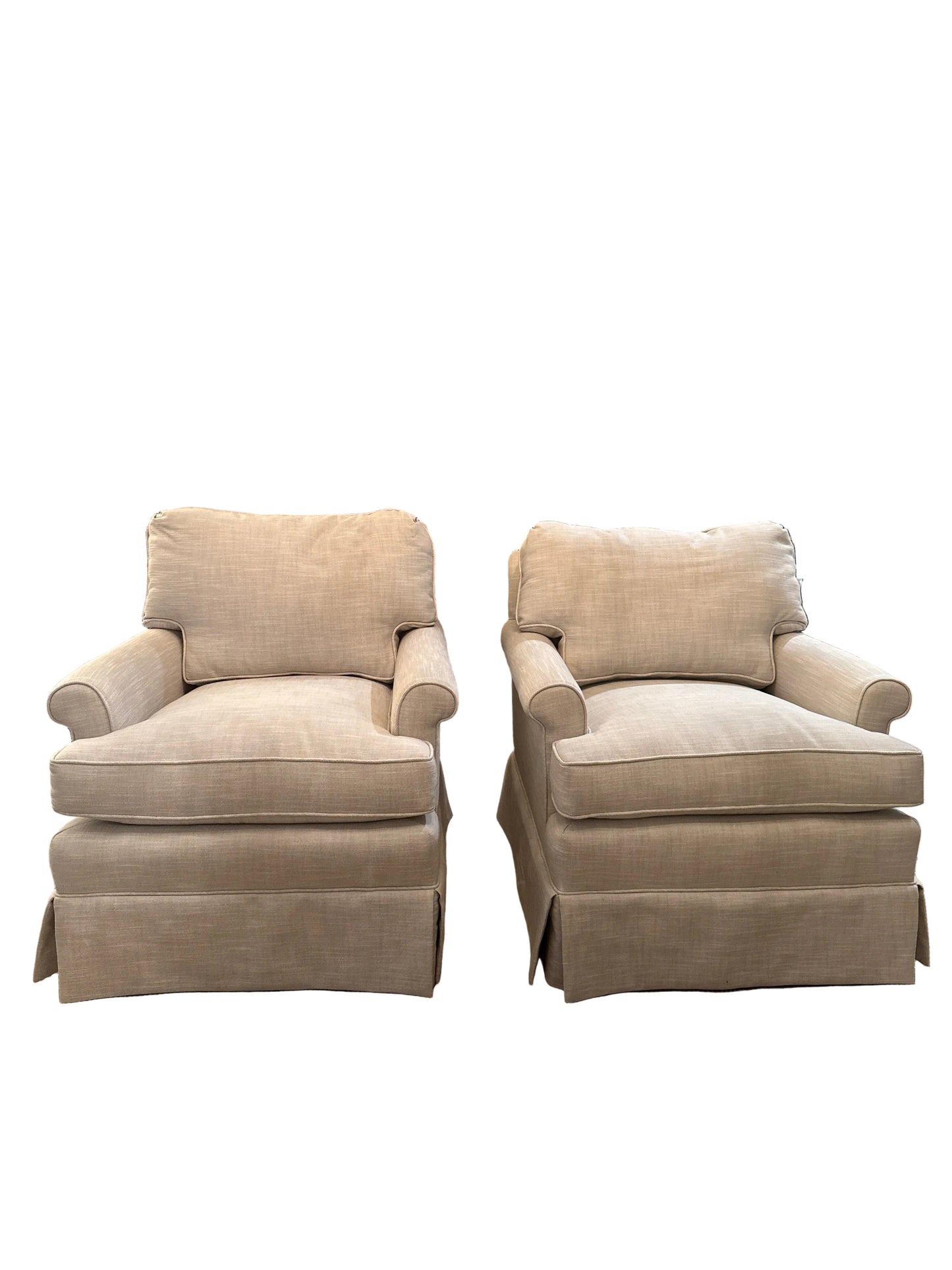 Pair of beige linen, newly upholstered vintage club chairs. Detached seat, cushion, and back cushion, rolled arm.