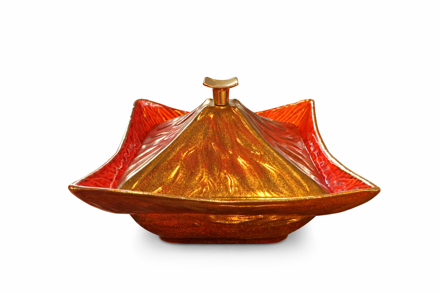 This vintage Mid-Century Modern California Originals drip glaze pottery pagoda dish with lid features a striking orange and gold glaze.
Design: Inspired by Chinese pagoda architecture, the dish has a pointed lid and a square telescoping base. Style: Mid-Century Modern (MCM) era, characterized by vibrant color glazing. 
Usage: Often used as a decorative candy dish, trinket box, or serving vessel. 