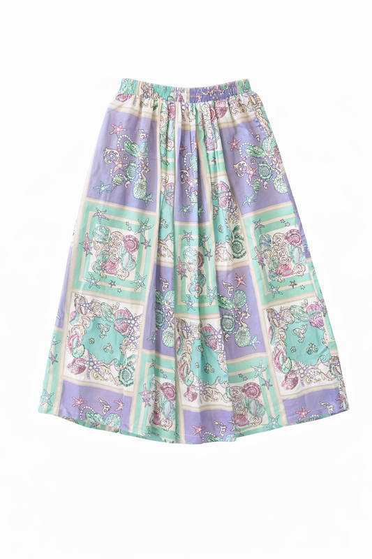 Colorful purple and teal shell patterned midi skirt on a white background.  Size small